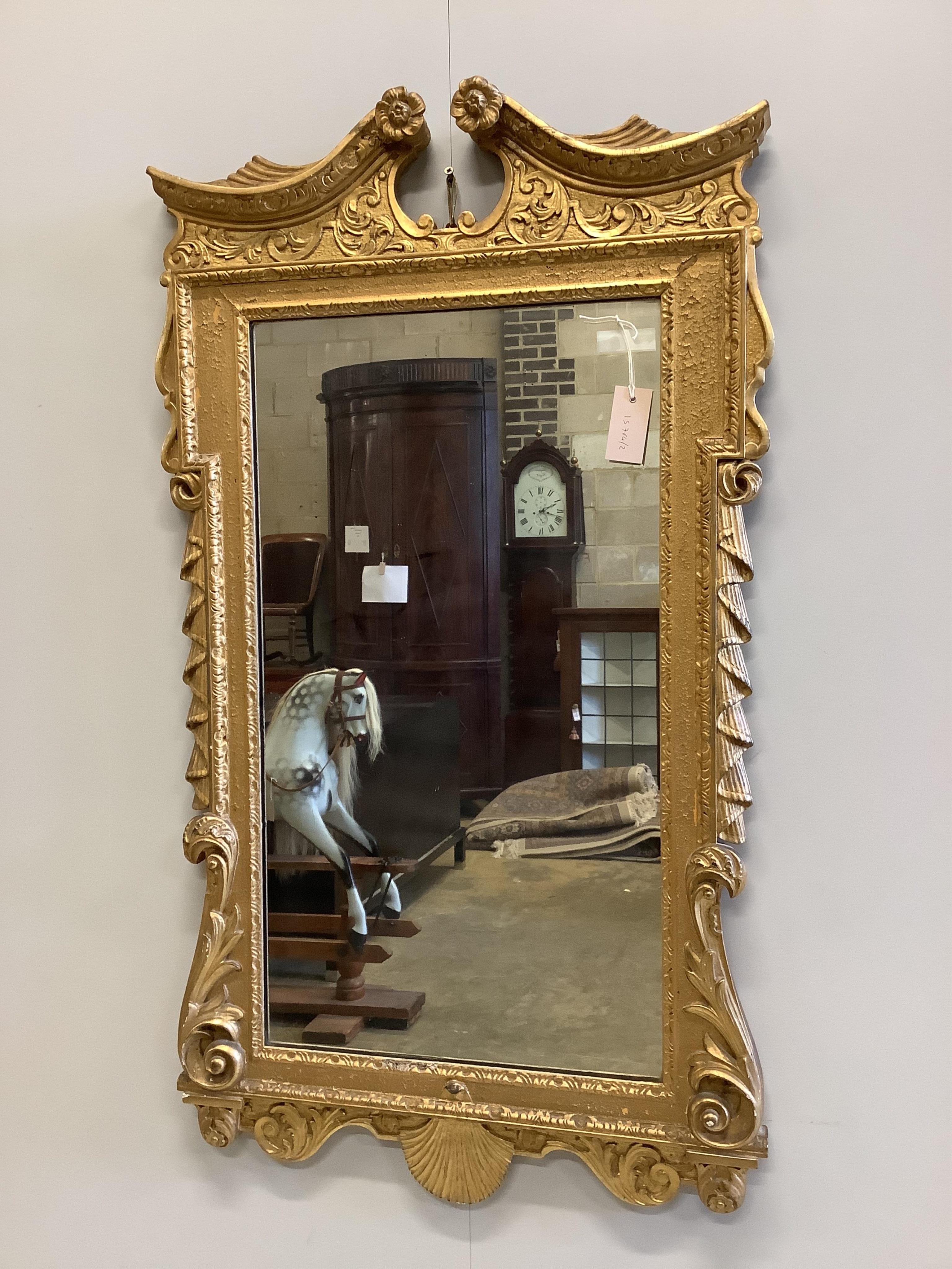 An Adams style giltwood and gesso wall mirror, width 61cm, height 108cm. Condition - fair to good